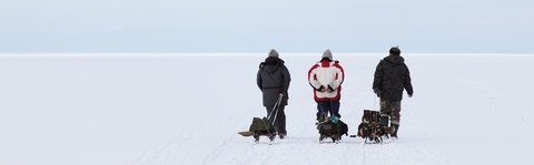 Three Men Pulling Ice fishing Sled